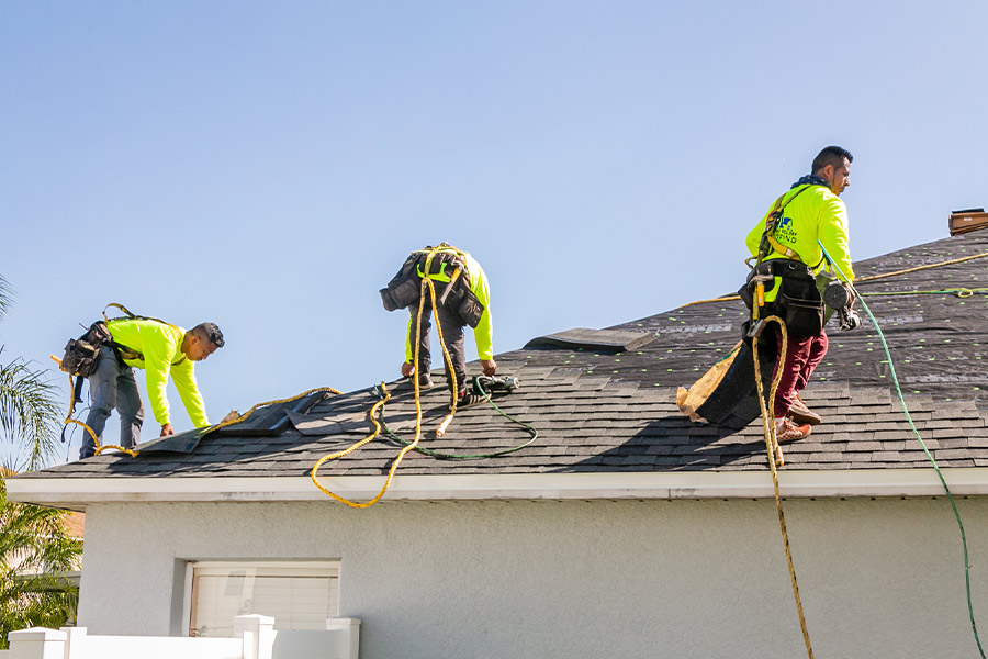 three roofers installing shingles orlando fl