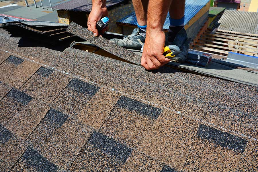 roofer installing shingles on roof apex oviedo fl