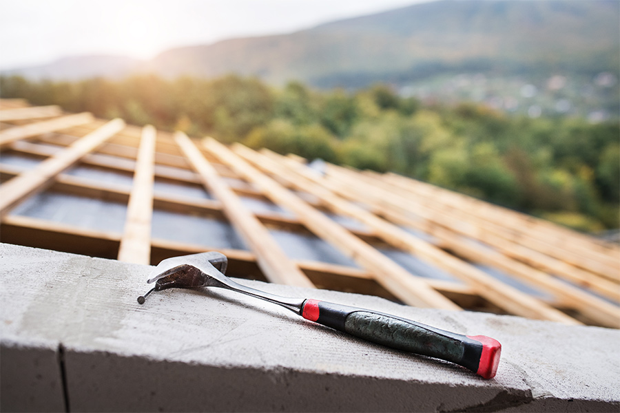 hammer on the roof on the construction site clermont fl